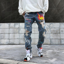 Load image into Gallery viewer, Graffiti print ripped jeans
