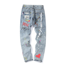 Load image into Gallery viewer, Graffiti print ripped jeans

