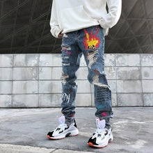 Load image into Gallery viewer, Graffiti print ripped jeans
