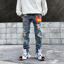 Load image into Gallery viewer, Graffiti print ripped jeans
